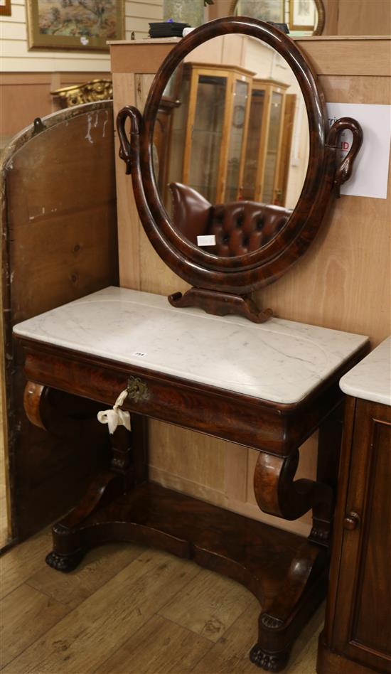 An Empire flame mahogany marble topped dressing table W.81cm